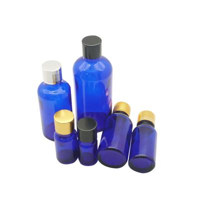 China Personal Care Frosted Blue Glass Bottle With Aluminum Cap Refillable Empty Essential Oil Bottles for sale