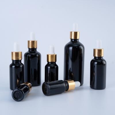 China 5ml 10ml 15ml 30ml 50ml Black Cosmetic Dropper E Liquid Bottles Essential Oil Bottles Glass Flasche Dropper for sale