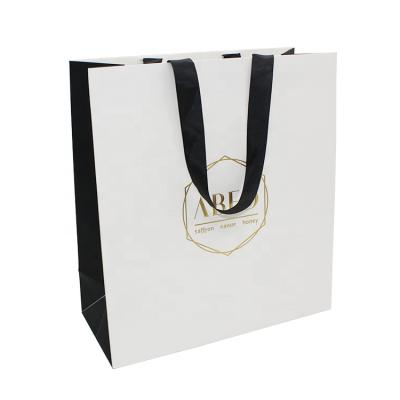 China Wholesale Custom Cheap Disposable Solid Color Paper Sack Black Gift Paper Bags Shopping Printing for sale