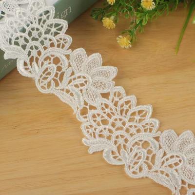 China Sustainable Fancy Hollow Pattern Design Polyester Embroidery Material Lace Trim for sale