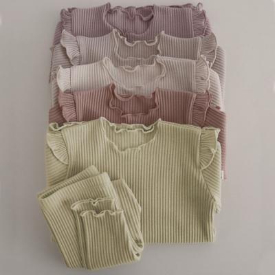 China Breathable Cute Baby Clothes Manufacturers Wholesales Ruffled Trim Cotton Warm Cute Ribbed Toddler Girl Kids Wear Pajamas Dress Sets for sale