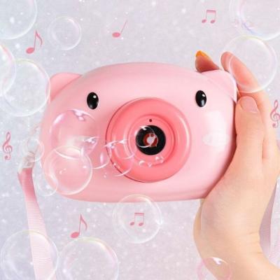 China Small Plastic Automatic Cute Pig Music Automatic Bubble Soap Maker Blowing Machine Toys for Kids Children Bubble Gun for sale