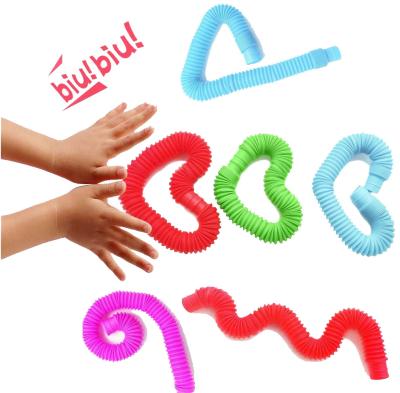 China Colorful fidgety person tube toys plastic sensory toys kids early stretch decompression hose development gifts 1.9*14cm for sale