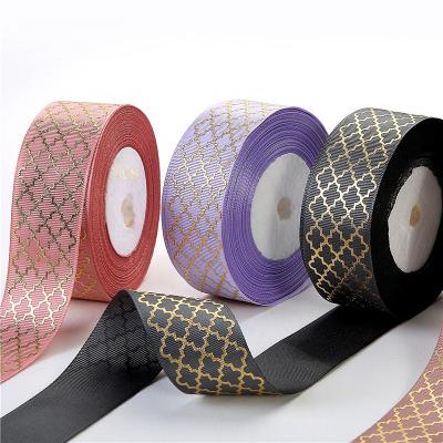 China Custom 4cm Floral 100% Polyester Printed Gold Foil Ribbons Embossed Hot Stamping Printed Ribbon Wholesale for sale