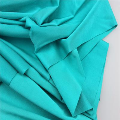 China Sportswear lady gaiters 180-240gsm 87 polyester 13 spandex knit single lycra fabric shiny hot sale for sale