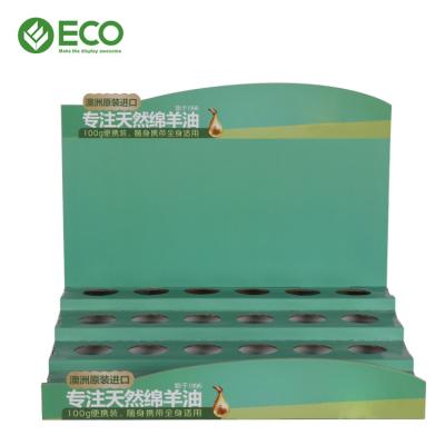 China Customized Logo Cardboard Display Rack Counter Essential Oil Cosmetic Display Stand for sale