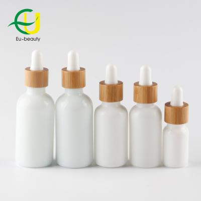 China Non Spill Porcelain 10ml-100ml White Oil Bottle With Bamboo Glass Dropper for sale