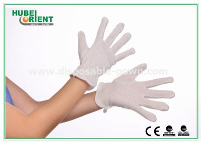 China Amigable al medio ambiente 100% de algodón puro suave guantes desechables de PVC con puntos de color blanco en venta