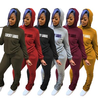 China 2021 Breathable Casual Hooded Letters Printed Pleated Sweatshirt Plus Size Autumn Clothing Set Two Piece Tracksuit For Women for sale