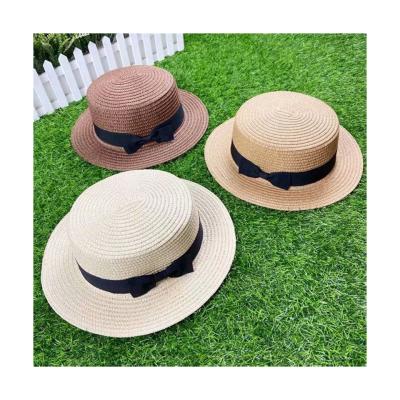 China Custom Retro Image Women Sunscreen Bowknot Sunscreen Straw Hat Flat Wide Brim Simple Elegant Beach Hat for sale