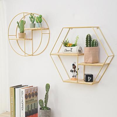 China Minimalist INS Metal Floating Wall Shelves Hanging Storage Display Stand Wall Mounted Hanging Shelf Gold Shelves Storage Rack for sale