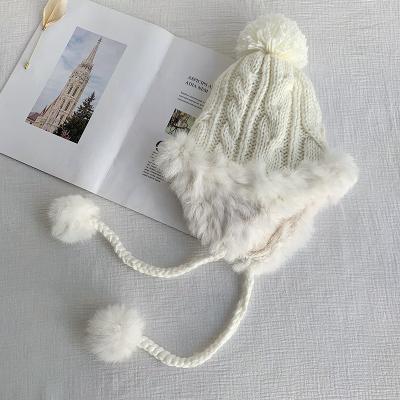 China Winter COMMON Wholesale Custom Knitted Beanie Hats Warm Knitted Rabbit Fur Pom Pom Hearing Protection Ski Hat for sale