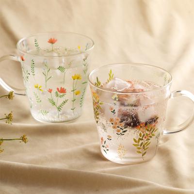 China Clear Hot Transparent Glass Cup Water Tea Coffee Stocked Glass Mug With Flower Cup Holder for sale