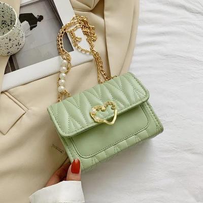 China 2021 Fashion Luxury Leather Purse Buckle Bags Women Heart Shaped Handbags for sale