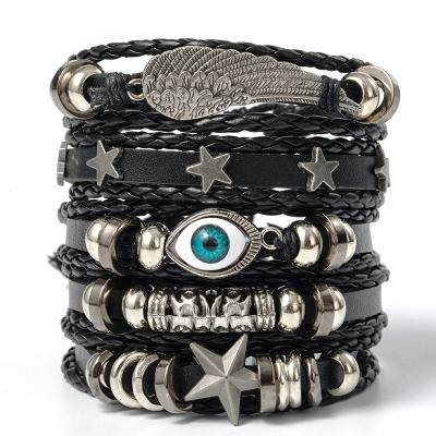 China TRENDY Vintage Leaf Feather Multilayer Leather Bracelet For Men Alloy Evil Eye Skull Charms Braided Bracelet for sale