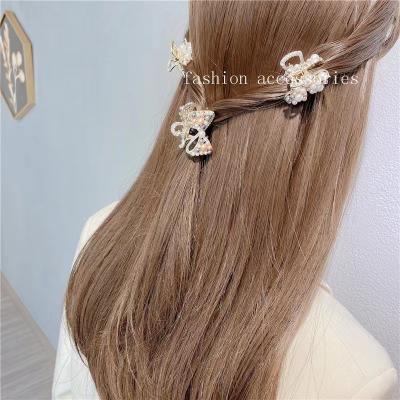 China Vintage feeling girl bowknot hair clip from hot Japan and South Korea wind hairpin hair beads small sharks paw design sweet for sale