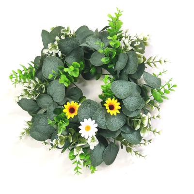 China Low price plastic sunflower and garland summer small daisy eucalyptus home decorative material wreath for sale