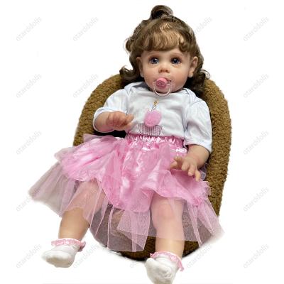 China Soft Toy 22Inch Reborn Open Eyes Baby Dolls Handmade Realistic Curly Hair Bebe Reborn Doll Brown Hair for sale