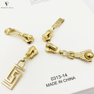 China Custom Metal Nickel Free Zipper Ends Key Zipper Sliders Puller With Letter Logo For Apparel And Bags for sale