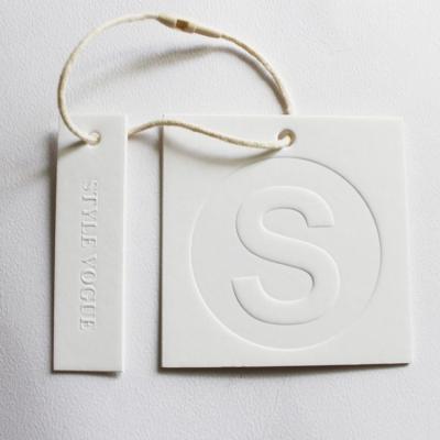 China Custom Embossed Die Cut Recycled Hang Tag Sustainable Craft Paper Eco Friendly for sale