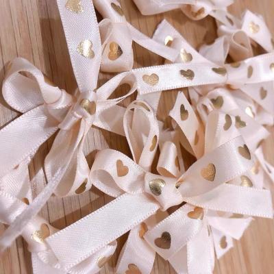 China High Tenacity Reasonable Price Ribbon Heart Flowers Pink Rose Grosgrain Ribbon Foil Gold Edge Butterfly Ribbon for sale