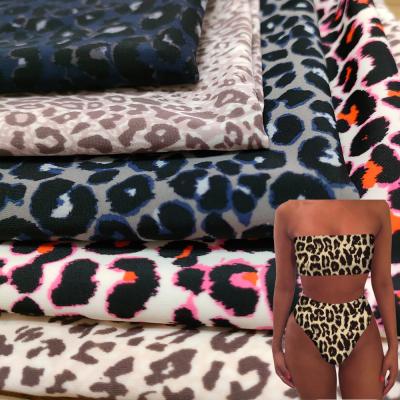 China Designer 4 way elastane recycled polyamide anti pill print stretch 82% nylon spandex custom leopard printed fabric for swimwear for sale