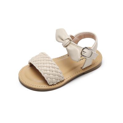 China Western Style Girls Round Bow Panel Shoes Beach Faux Leather Woven Soft Bottom Sandals for sale