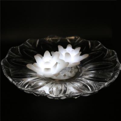 China Reusable Battery Operated White LED Floating Lotus Wax Candle Light Flameless Water Lily Floating Candle for sale