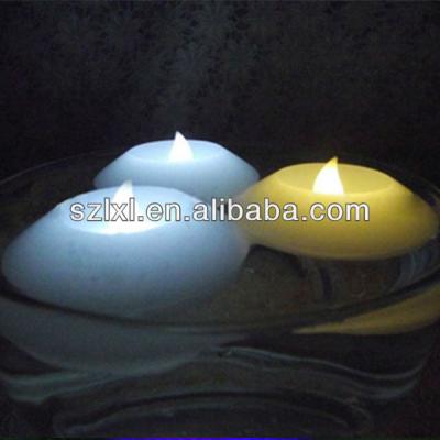 China Water activated battery operated flameless real water wax LED floating candle for vase decoration for sale