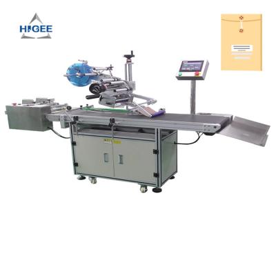 China Higee machinery sticker labeling machine for plastic bag paper bag alu bags labeling applicator for sale