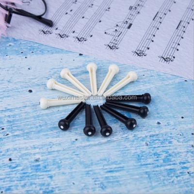 China Deluxe Plastic Acoustic Guitar Bridge Pins String Peg Guitar Parts Replacement for sale