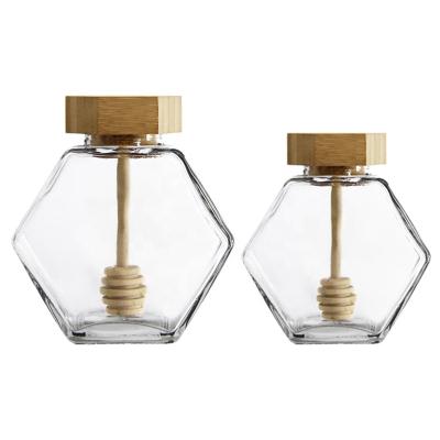 China Minimalist Honey Glass Jar with Wooden Storage Dipper and Cork Lid Cover Hexagon Shape for sale