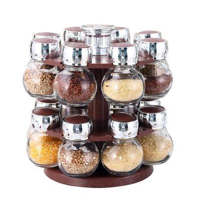 China Fashion 8 Or 16 Cans Freshness Storage New Revolving Spice Jar Rack Kitchen Countertops Spice Shelf Spice Jar Shaker Top Glass Jar for sale