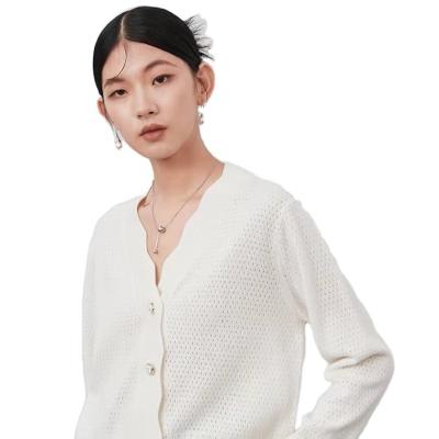 China Anti-wrinkle wavy side v-neck knitted sweater jacket women 2022 new hollow-out wool cardigan sweaters coat for sale