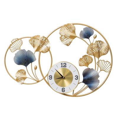 China Contemporary Light Luxury Wrought Iron Bedroom and Living Room Gingko Leaf Wall Clock Metal 3D Wall Art Interior Decor for Home for sale