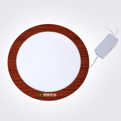 China El grano de madera pesado redondo de la luz del panel del LED 18W aisló el conductor en venta