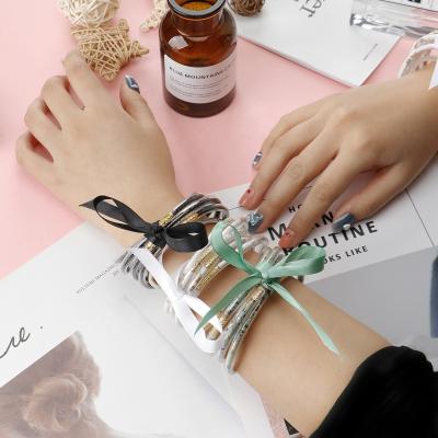 China New Transparent Silicone Glitter Bowknot Ribbon Five-Piece Silicone Jelly Casual/Sports Wristband for sale