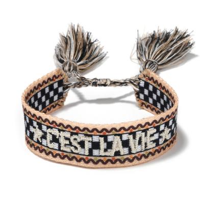 China Trendy New Fashion Woven Letter Bracelet Tassel Friendship Bracelet Embroidered Bracelet for sale