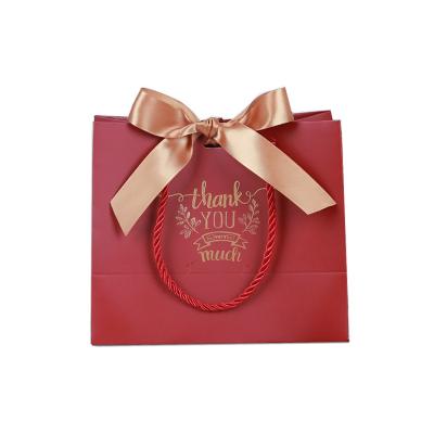 China Luxury Cute Recyclable Ribbon Bow Cosmetics Packaging Gift Paper Bag For Cosmetics, Custom Ribbon Gift Bag With Logo Paper for sale