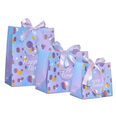 China Recyclable Luxury Christmas Gift Packaging Eco Paper Bag With Ribbon Handle for sale