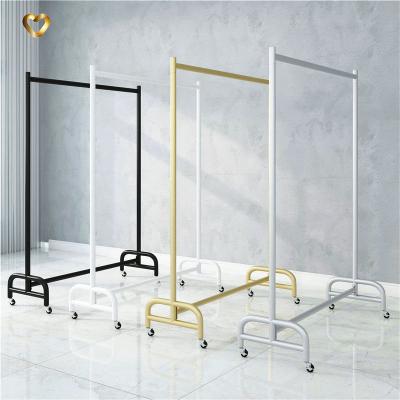 China Clothing Store Strong Stable Black Clothing Shelf Display Rack Women Movable Floor Type Clothes Rack With Wheels for sale