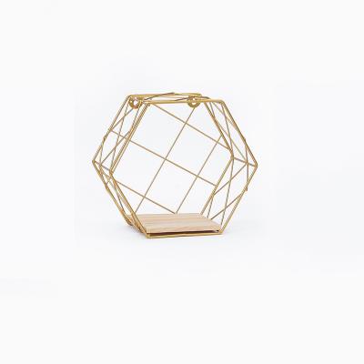 China Beautiful Hexagonal Grid Twill Iron Wall Hanging Shelf Gold Iron Opens Wrought Iron for sale