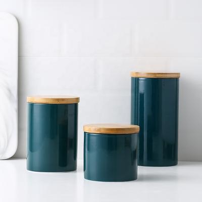 China Nordic minimalist dark green ceramic sealed jar freshness preservation storage with wooden lid for sale