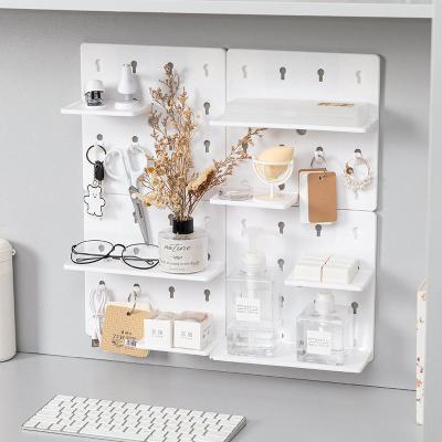 China Hot Selling Display Rack Peg Board Plastic Home Decor Shelf Wall Hanging Storage Rack Household Free Punch Accessories for sale