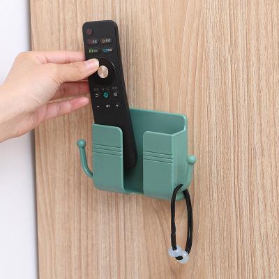 China 4-Color Modern Hot Sale Modern Wall Mounted Remote Wall Mounted Cell Phone Socket Storage Box Cell Phone Socket Multi-Function Hook for sale