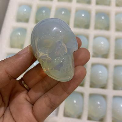 China New arrivals white opalite from Europe carved reiki healing crystals skulls figurines for home decoration for sale