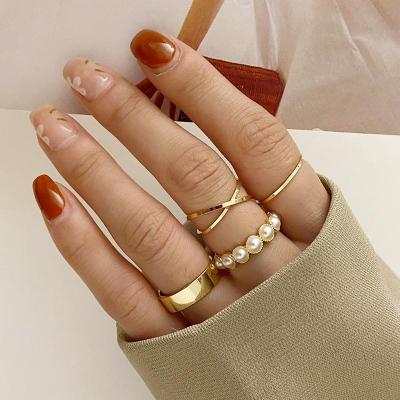 China Other Fashionable Gold Pearl Rings Set For Women Girls Korean Finger Ring Simple Cross Rings for sale