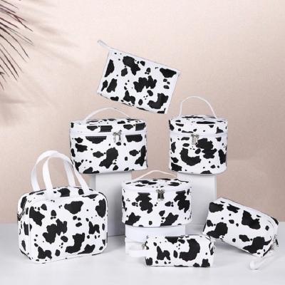 China Fashionable Wholesale Custom Cosmetic Bags Cow Pattern Pouch Multifunctional Organizer Beauty Storage PU Bag Makeup Bag and Cases for sale