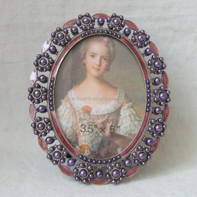 China Long Lasting Purple Beads with Pink Enamel Oval Girls Photo Frame (P0163135a) for sale