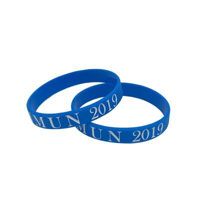 China New fashion cheap promotional design enviroment friendly gift debossed ink filled blue silicone wrist band for sale